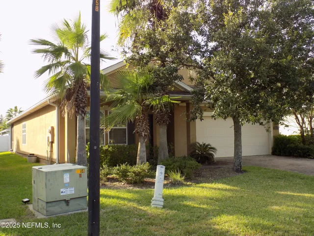a view of a house with a tree