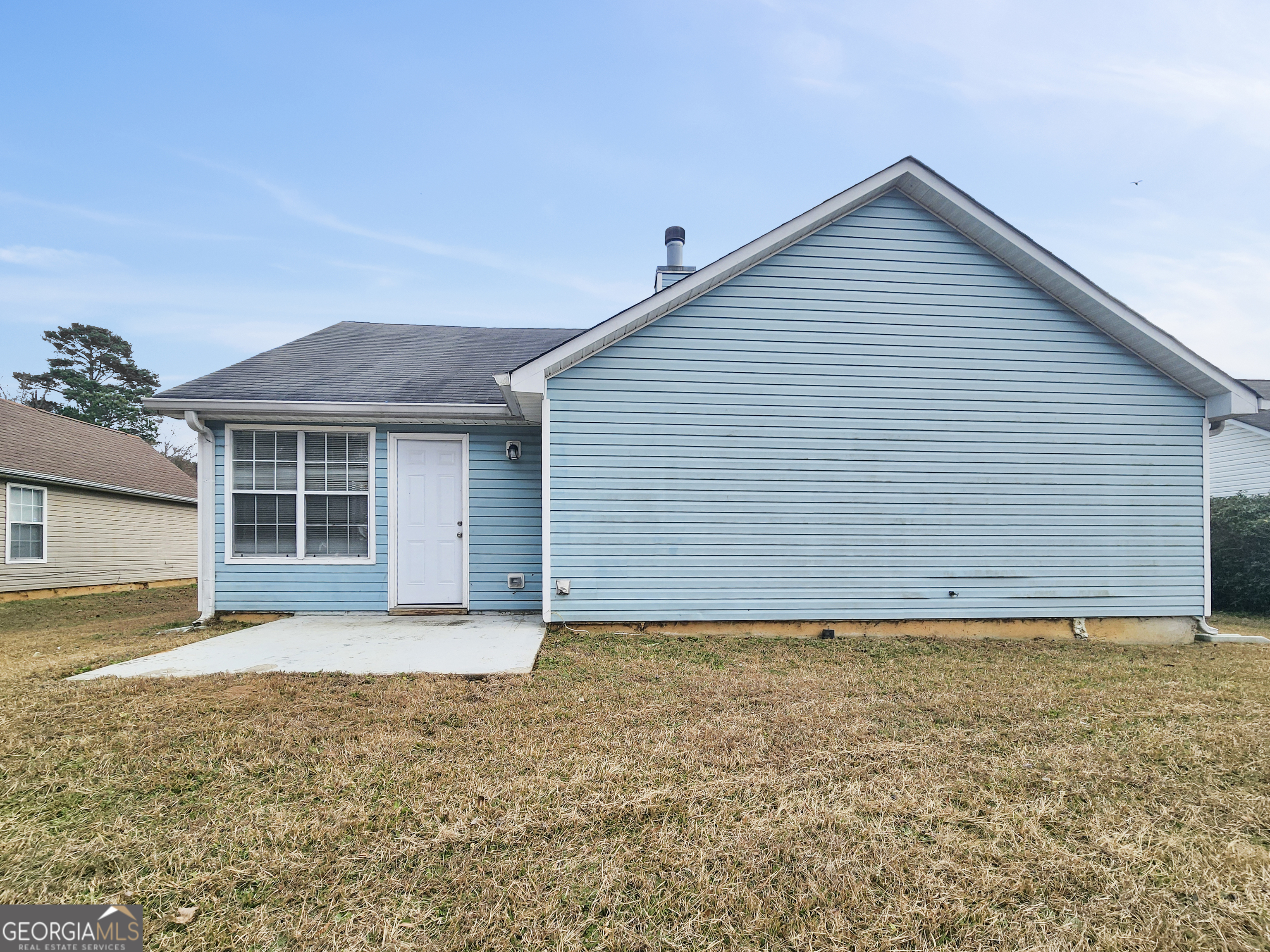 5855 Creekside Drive Rex, GA 30273 - Photo 16 of 18 a view of a house with a backyard