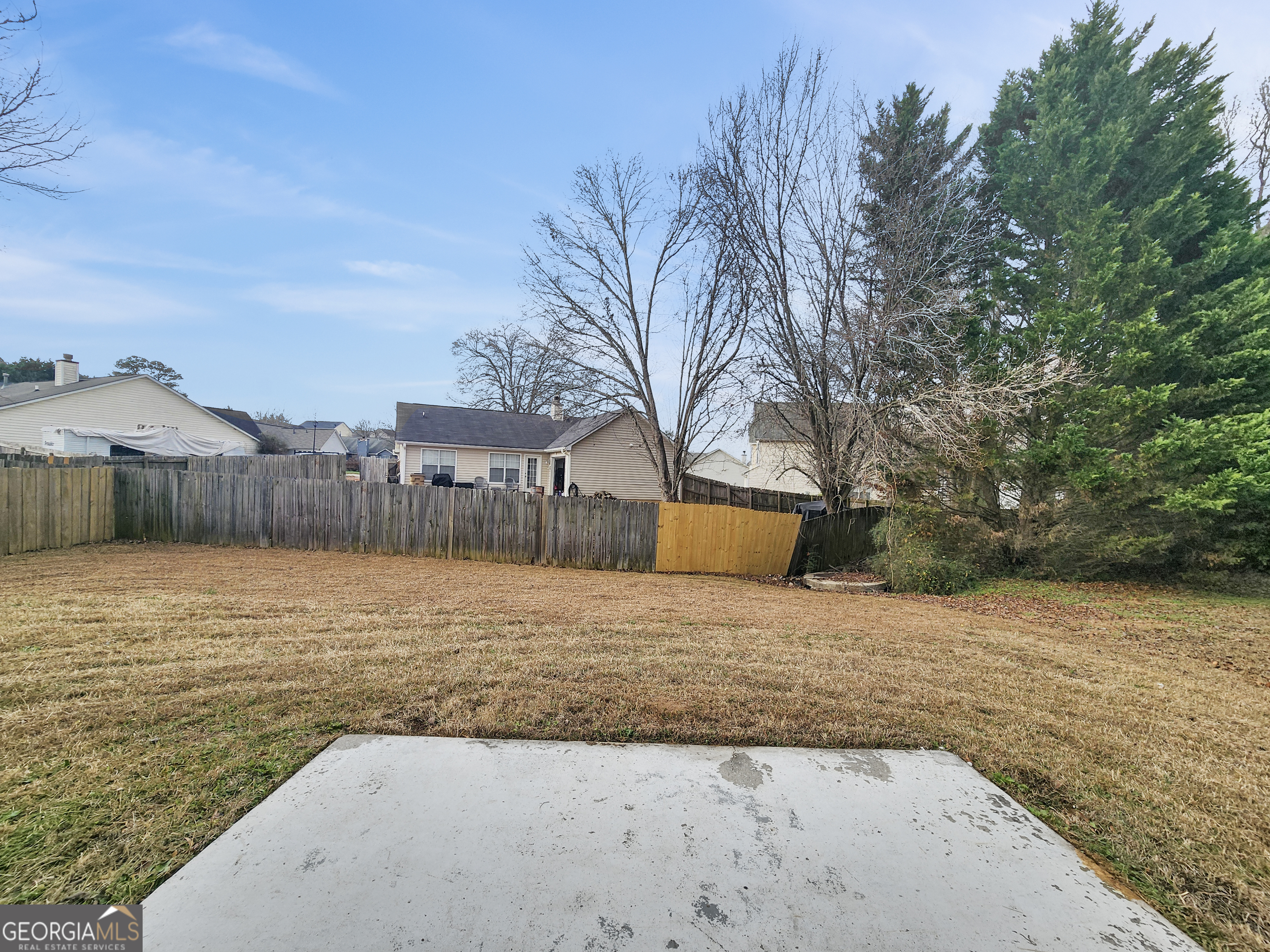 5855 Creekside Drive Rex, GA 30273 - Photo 17 of 18 a view of a dry yard with wooden fence