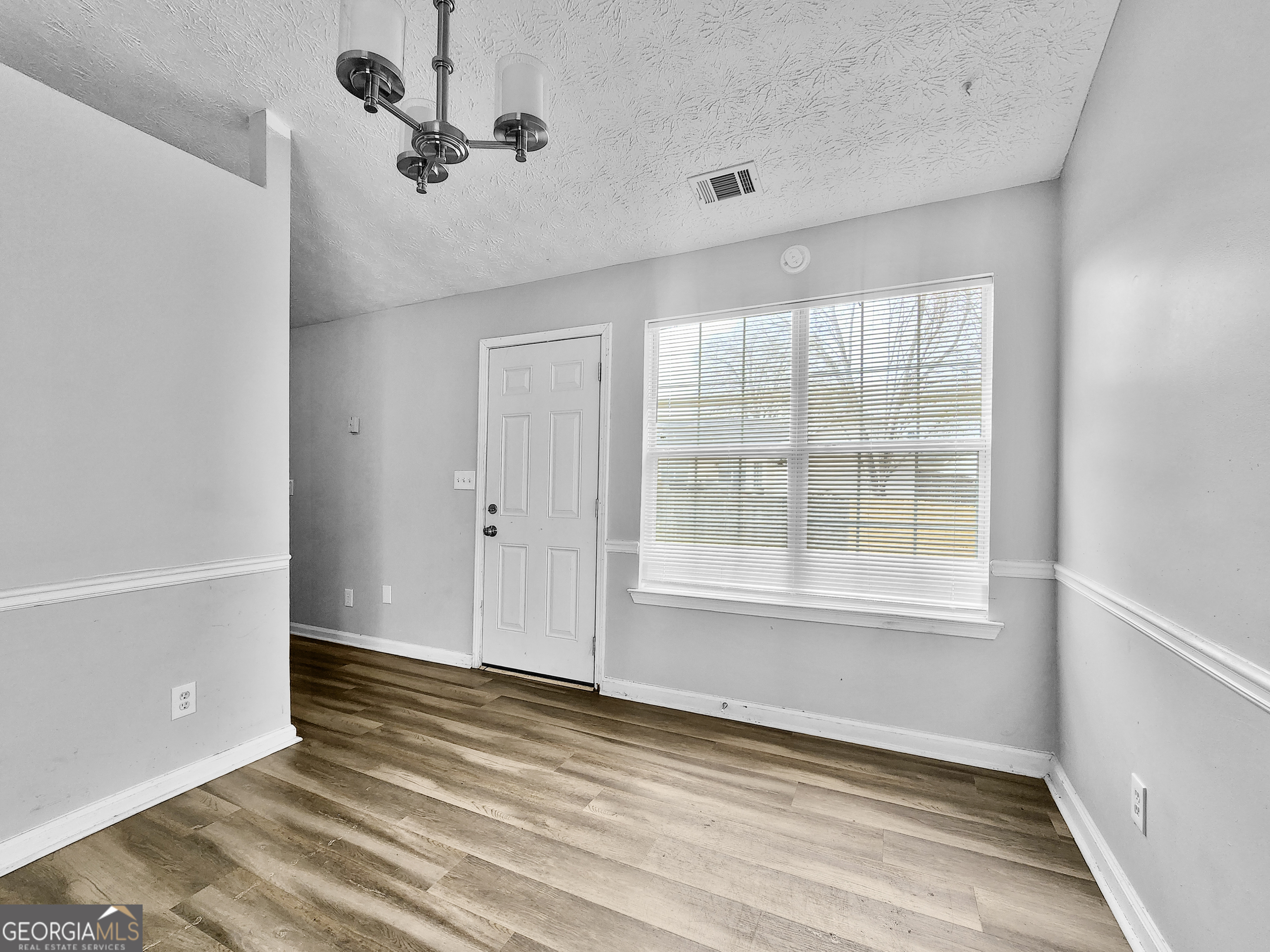 5855 Creekside Drive Rex, GA 30273 - Photo 6 of 18 a view of an empty room with a window