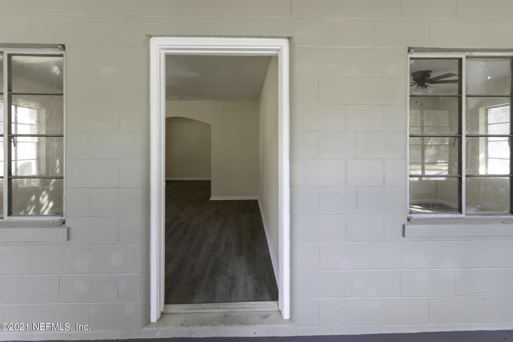 3921 St Augustine Road Jacksonville, FL 32207 - Photo 8 of 35 an entryway with wooden floor and a cabinet