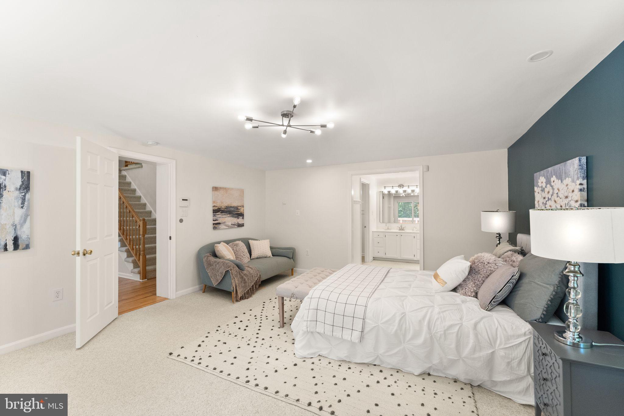 38620 Lime Kiln Road Leesburg, VA 20175 - Photo 31 of 87 a bedroom with a bed and a lamp