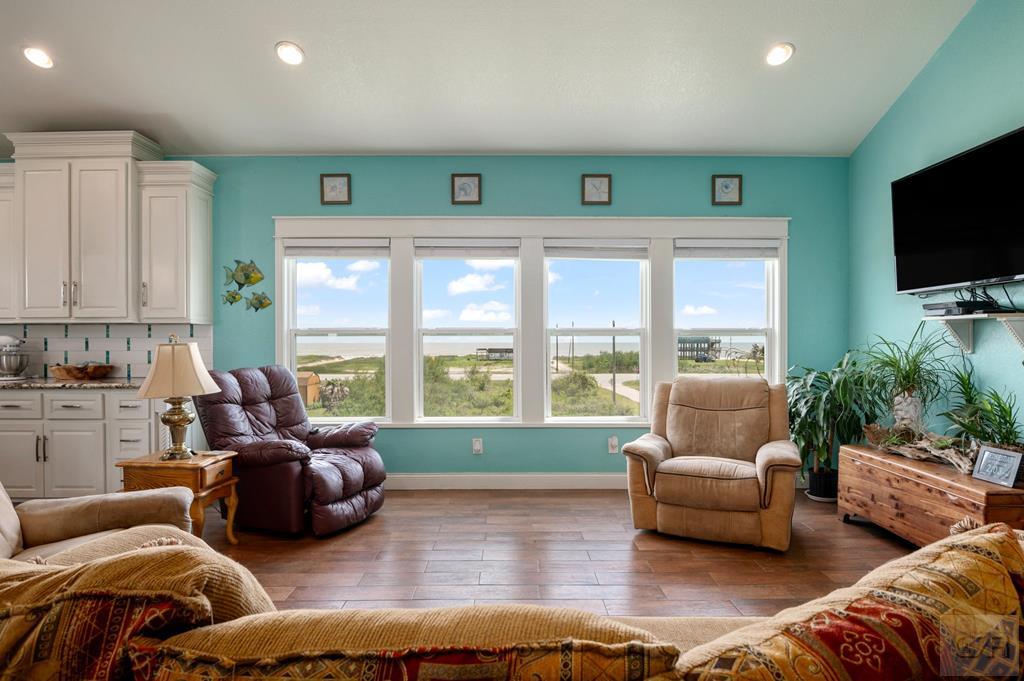 1024 Mae Street Port Bolivar, TX 77650 - Photo 11 of 27 a living room with furniture and a flat screen tv