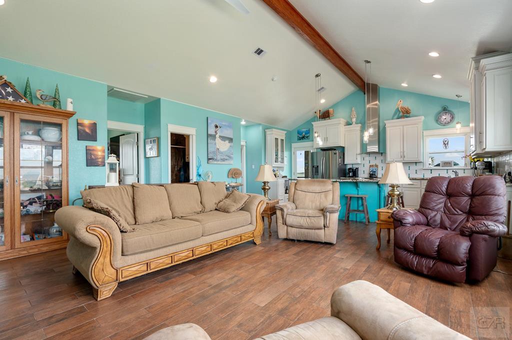 1024 Mae Street Port Bolivar, TX 77650 - Photo 12 of 27 a living room with furniture and a large mirror
