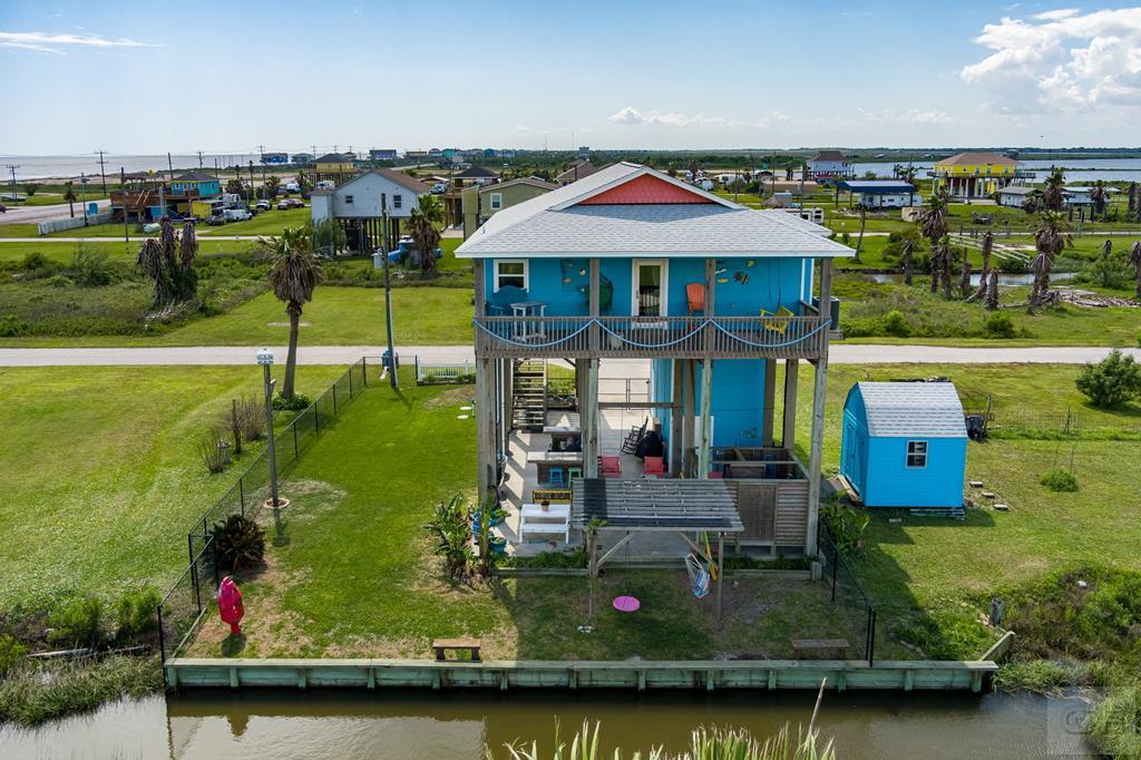 1024 Mae Street Port Bolivar, TX 77650 - Photo 4 of 27 an aerial view of a house with a garden and lake view