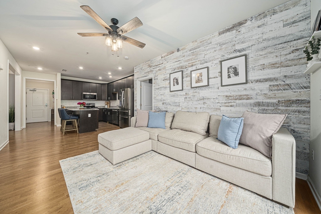70 Trotter Road, Unit 310 Weymouth, MA 02190 - Photo 3 of 14 a living room with furniture and kitchen view