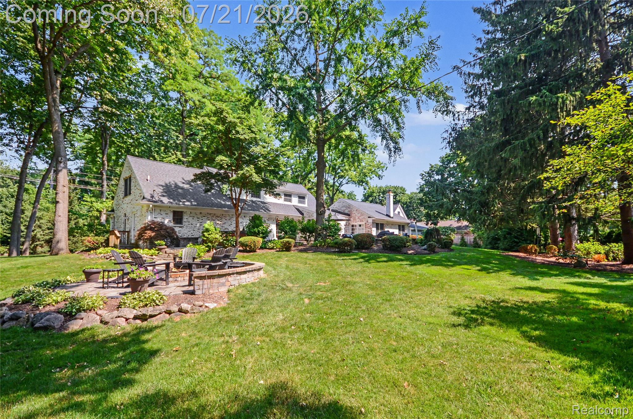 3780 Squirrel Road Bloomfield Hills, MI 48304 - Photo 48 of 59 Expansive backyard featuring a manicured lawn and mature trees and garden beds.