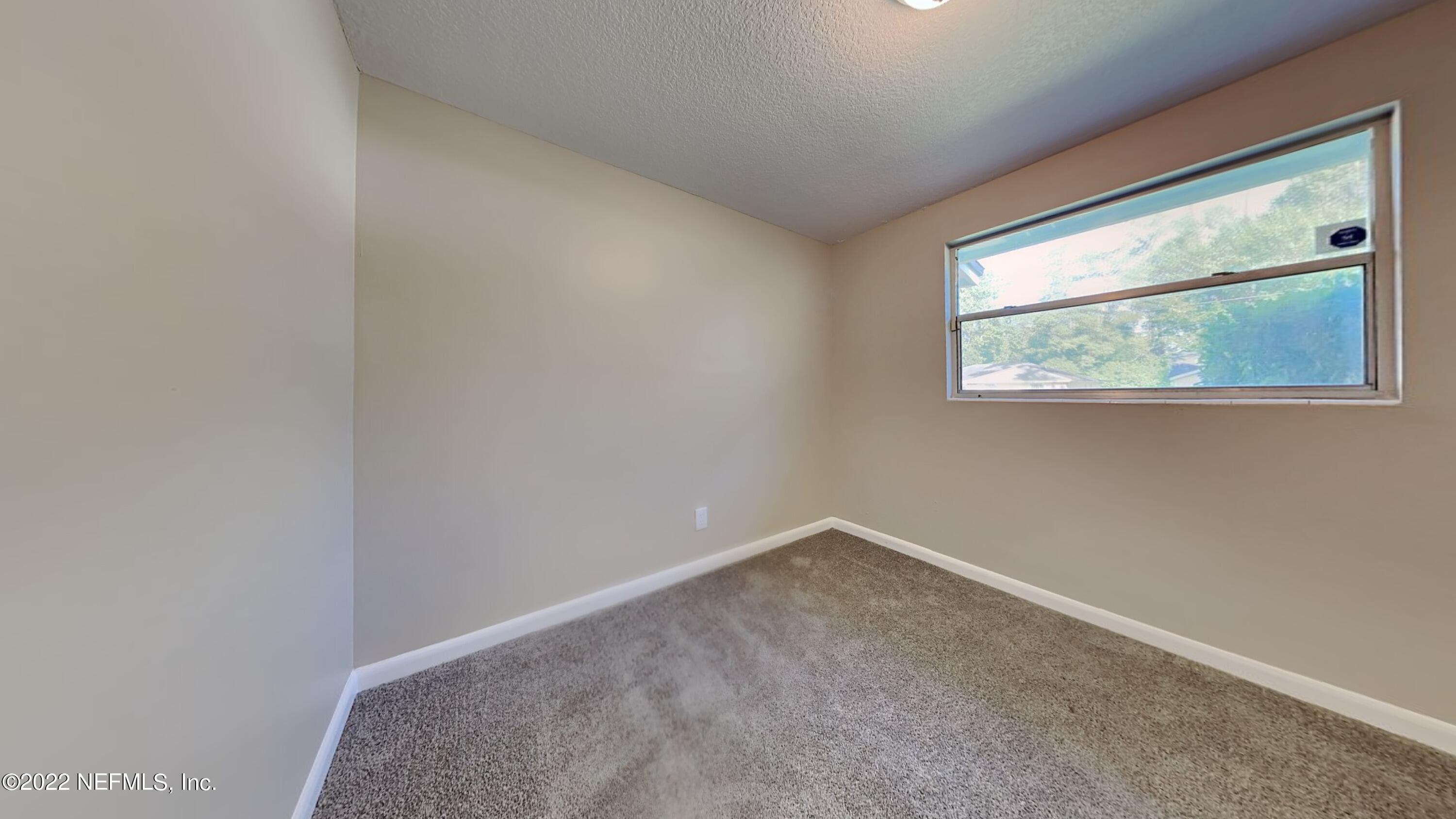 10729 Tulsa Road Jacksonville, FL 32218 - Photo 13 of 21 a view of room with window