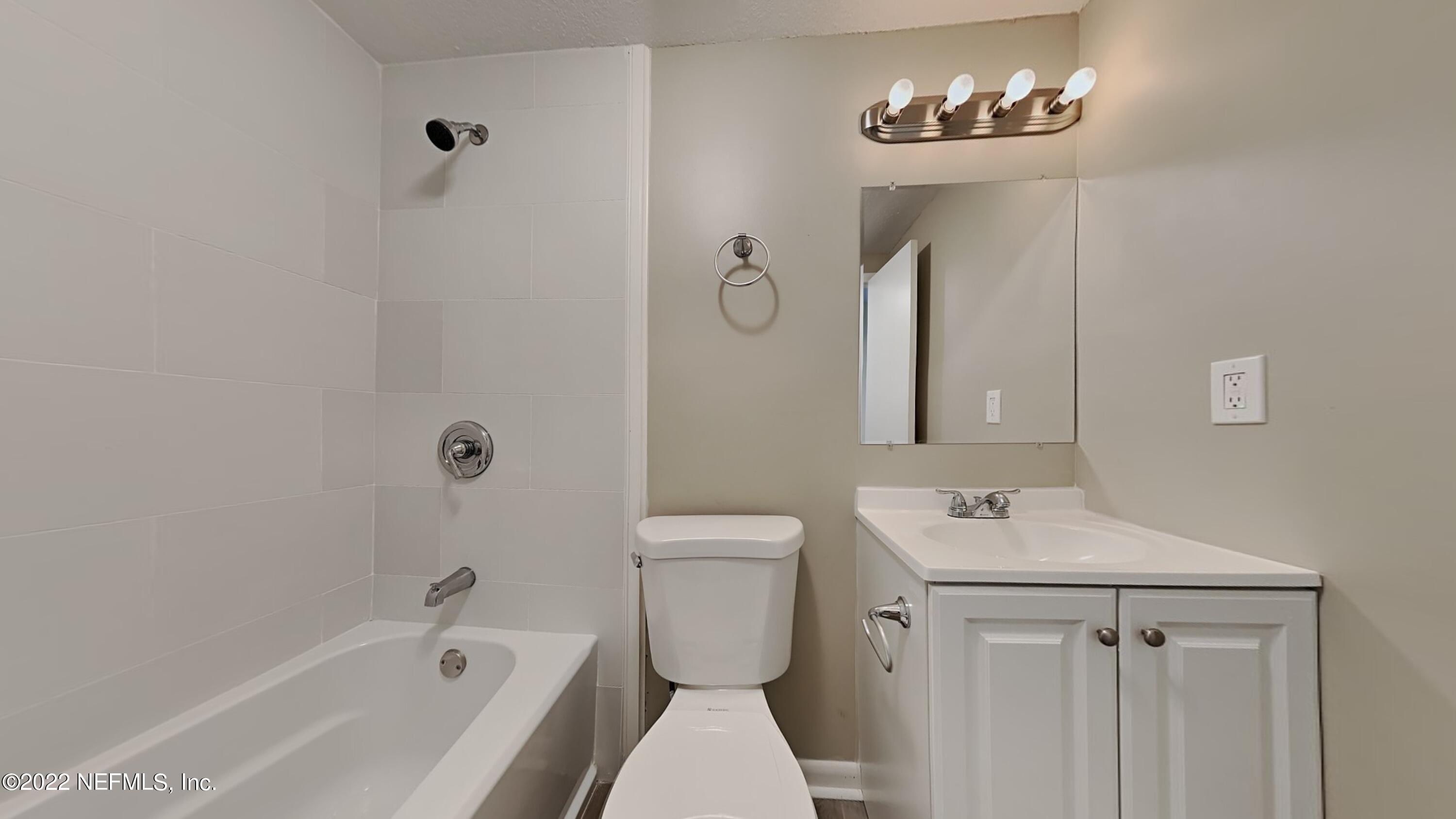 10729 Tulsa Road Jacksonville, FL 32218 - Photo 17 of 21 a bathroom with a sink toilet and shower