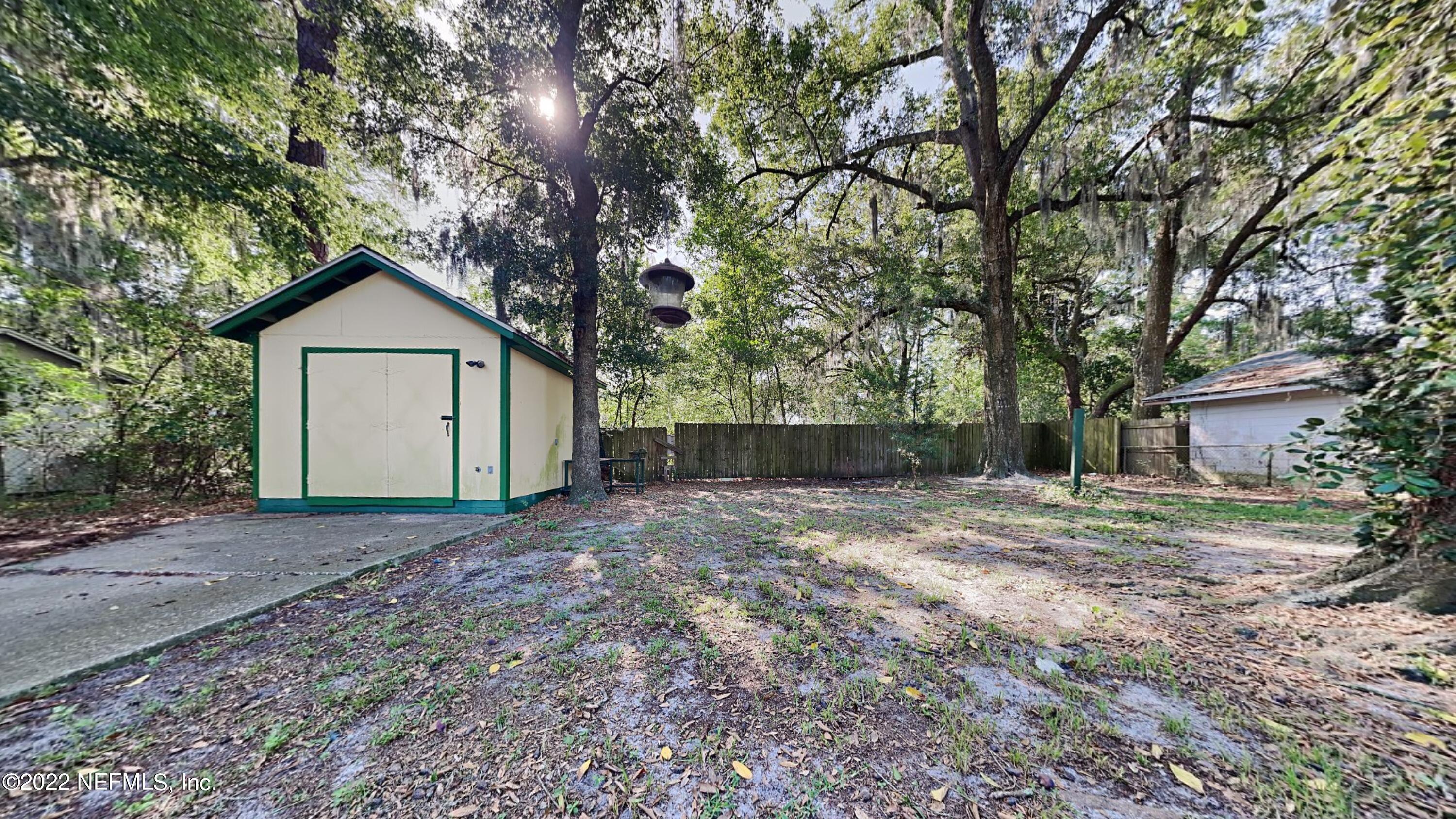 10729 Tulsa Road Jacksonville, FL 32218 - Photo 19 of 21 a house with trees in the background