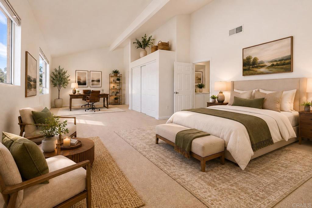 4595 Blackwell Road Oceanside, CA 92056 - Photo 37 of 47 a spacious bedroom with a bed couch and a large mirror