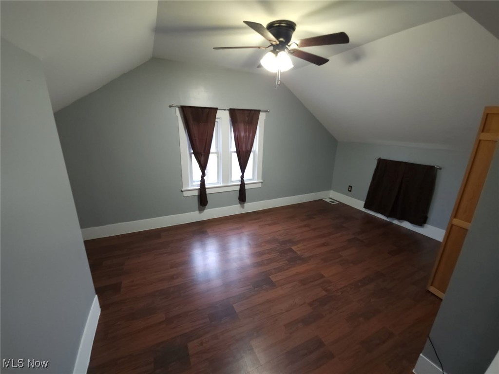 30 Medina Street Rittman, OH 44270 - Photo 20 of 28 Bonus room with dark wood finished floors, lofted ceiling, and ceiling fan
