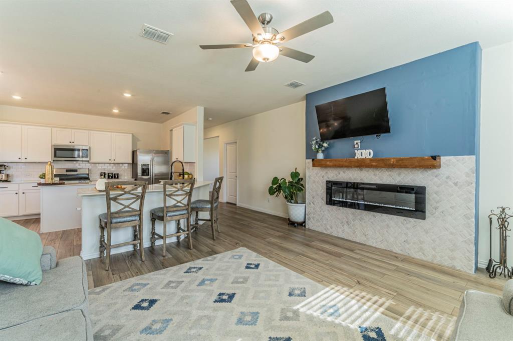 1240 Almond Road Azle, TX 76020 - Photo 24 of 26 a view of kitchen with sink microwave and dining table
