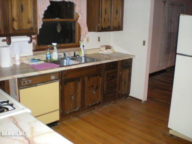 23929 Carroll Road Lanark, IL 61046 - Photo 11 of 25 a kitchen with a sink cabinets and wooden floor