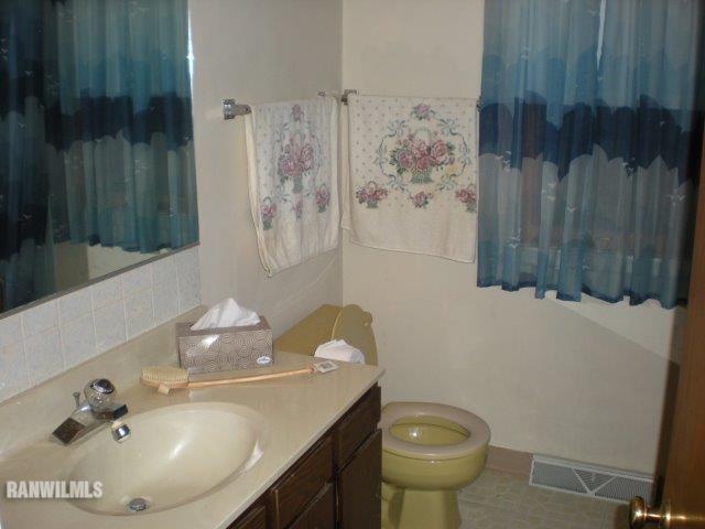 23929 Carroll Road Lanark, IL 61046 - Photo 18 of 25 a bathroom with a sink toilet and shower