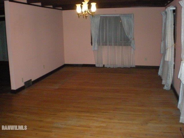 23929 Carroll Road Lanark, IL 61046 - Photo 5 of 25 a view of an empty room with a fireplace