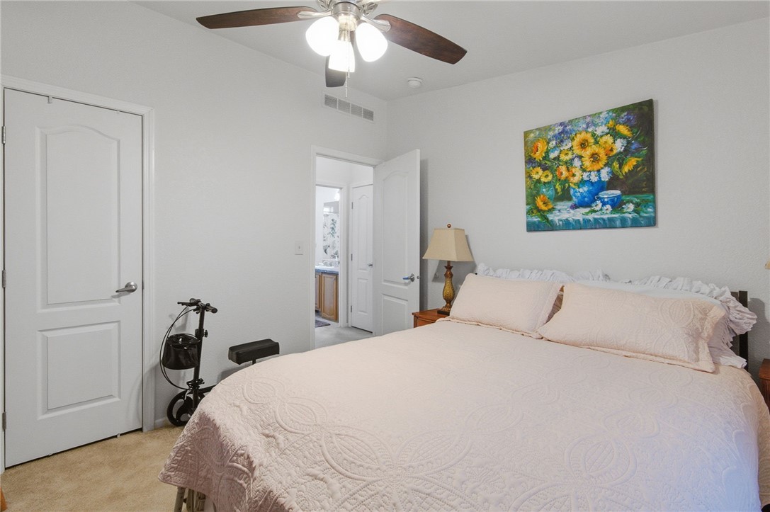 4342 Cordes Road Golden Valley, AZ 86413 - Photo 27 of 39 a bedroom with a bed and a chandelier