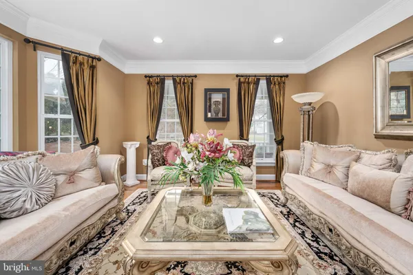 a spacious bathroom with a double vanity sink a large mirror and a bathtub
