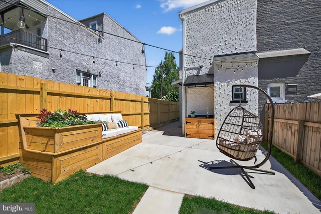 a view of a backyard with furniture