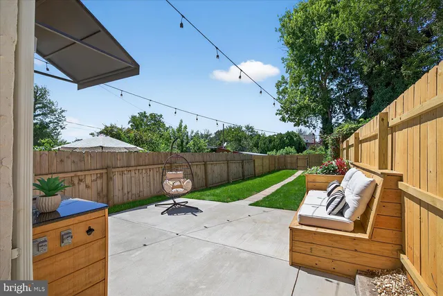 a view of a backyard with a tree