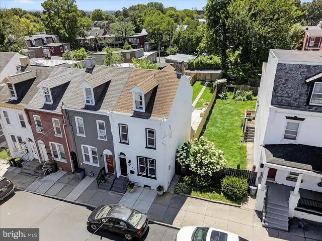 a picture of a bench in front of a wall