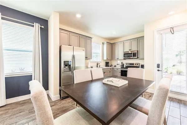 a bathroom with a sink vanity mirror and toilet
