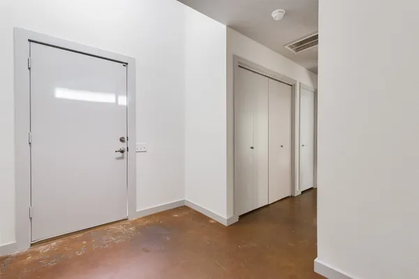 a view of entryway with wooden floor
