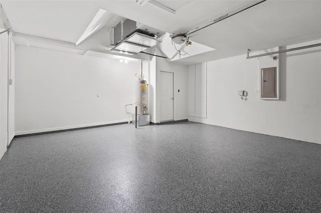 en empty room with windows and ceiling fan