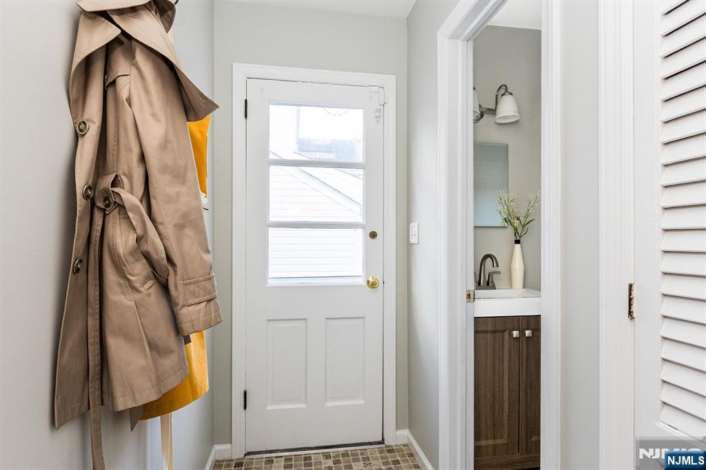 199 Stonehouse Road Bloomfield, NJ 07028 - Photo 16 of 36 a view of walk in closet with clothes and shoes