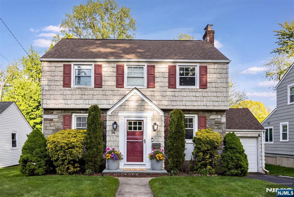 199 Stonehouse Road Bloomfield, NJ 07028 - Photo 2 of 36 a front view of a house with a yard and potted plants