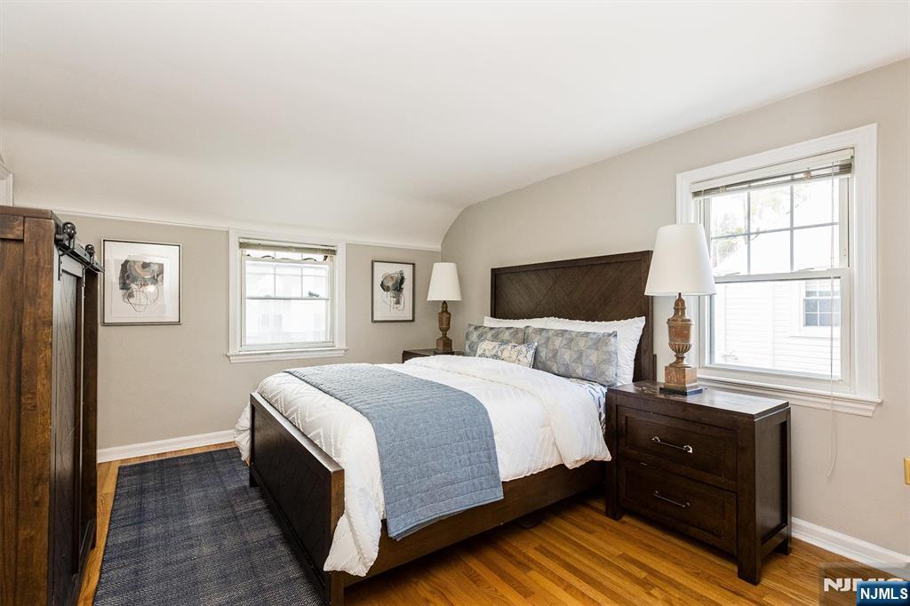 199 Stonehouse Road Bloomfield, NJ 07028 - Photo 24 of 36 a bedroom with a bed and wooden floor