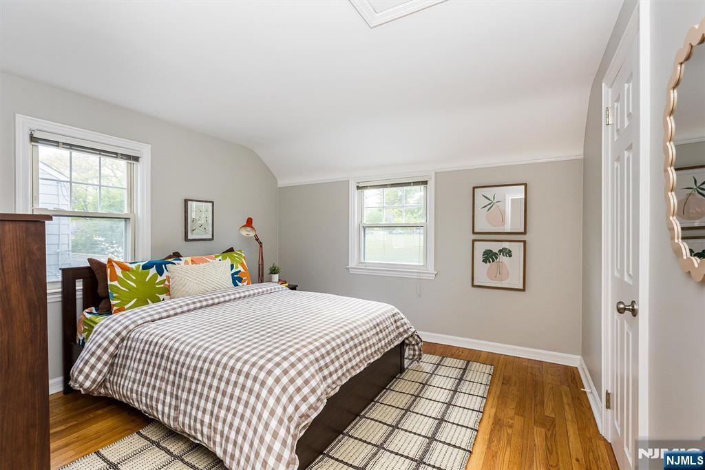 199 Stonehouse Road Bloomfield, NJ 07028 - Photo 27 of 36 a bedroom with a bed and wooden floor