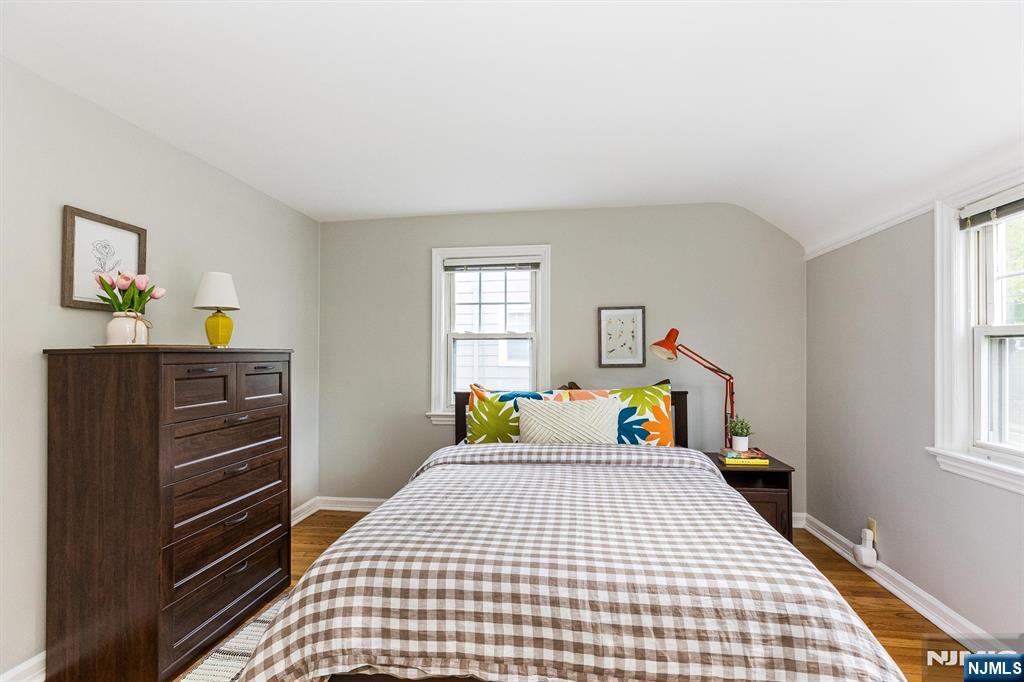 199 Stonehouse Road Bloomfield, NJ 07028 - Photo 28 of 36 a bedroom with a bed and wooden floor