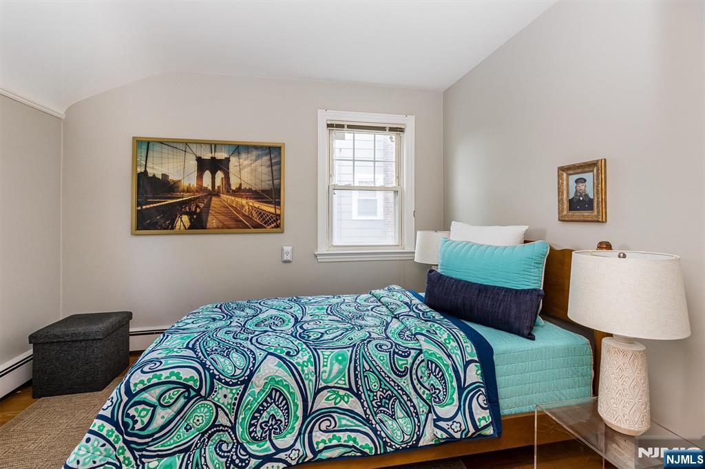 199 Stonehouse Road Bloomfield, NJ 07028 - Photo 29 of 36 a bedroom with a bed and a window