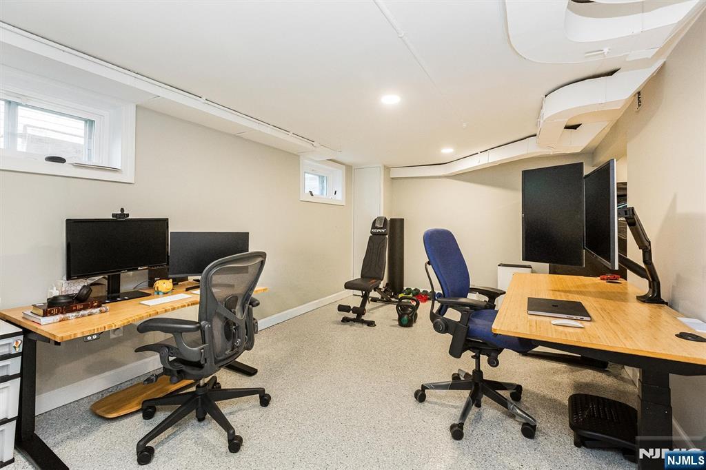 199 Stonehouse Road Bloomfield, NJ 07028 - Photo 30 of 36 a view of a workspace with gym cycle and a window