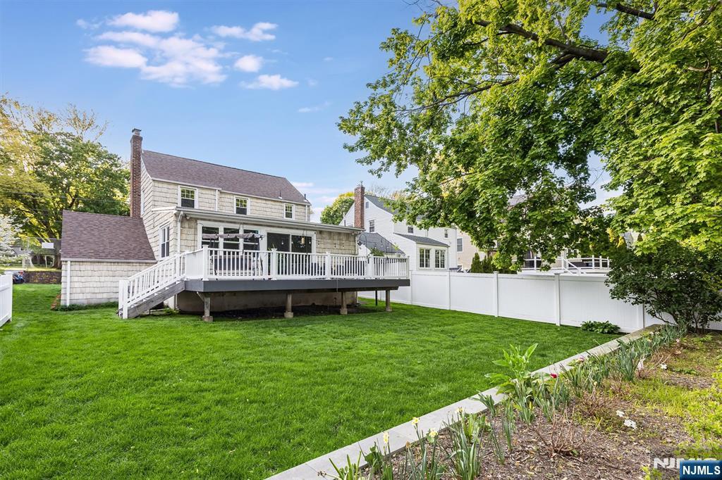 199 Stonehouse Road Bloomfield, NJ 07028 - Photo 34 of 36 a view of a house with a yard and sitting area