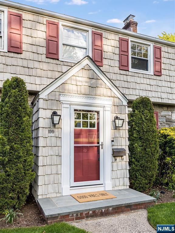 199 Stonehouse Road Bloomfield, NJ 07028 - Photo 4 of 36 a view of a brick house with large windows