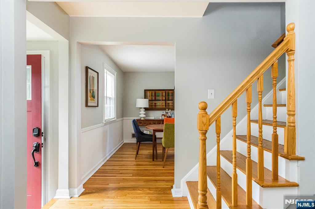 199 Stonehouse Road Bloomfield, NJ 07028 - Photo 6 of 36 a front view of a house with wooden floor and stairs