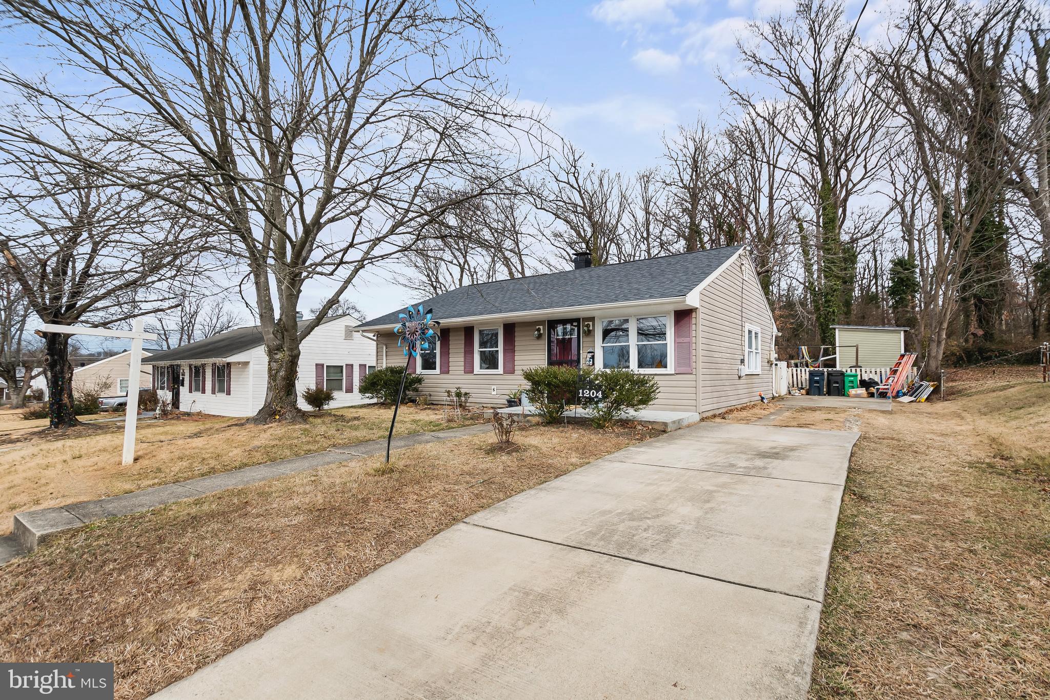 a view of a yard with a house and trees