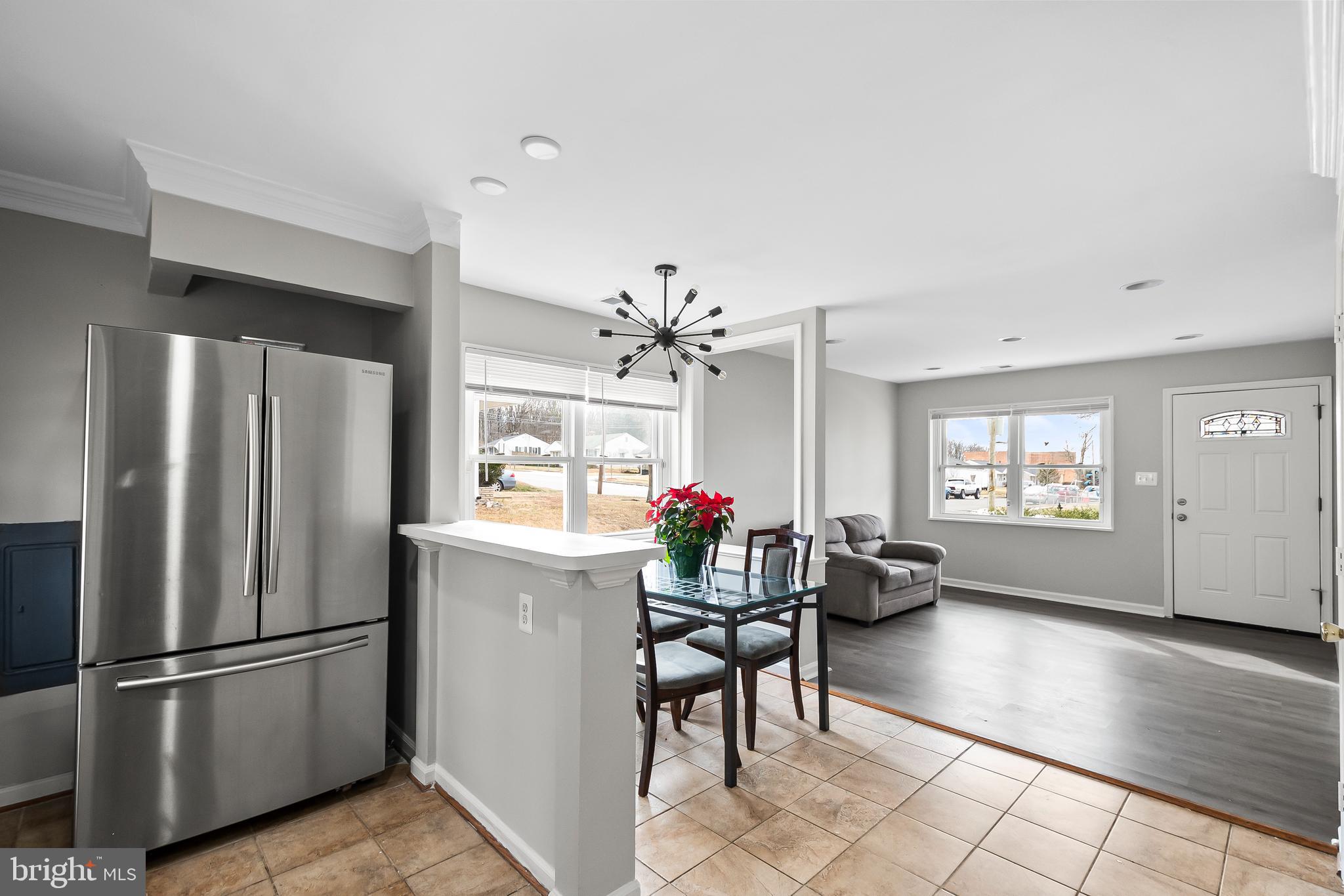 1204 Lindsay Road Oxon Hill, MD 20745 - Photo 13 of 28 a kitchen with refrigerator and cabinets