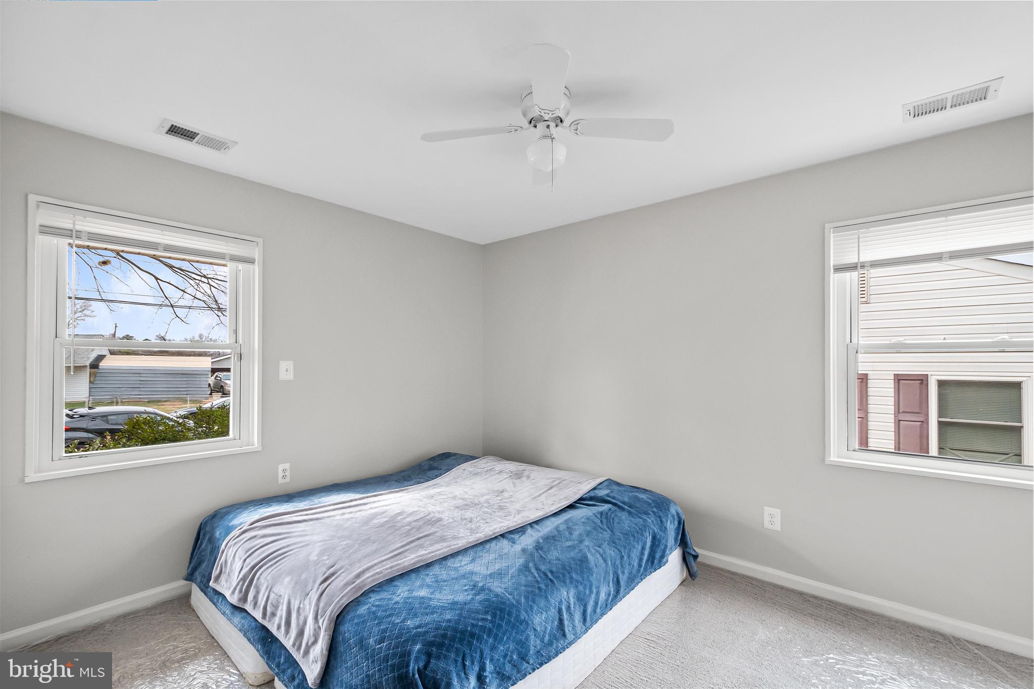 1204 Lindsay Road Oxon Hill, MD 20745 - Photo 16 of 28 a bedroom with a bed and a window