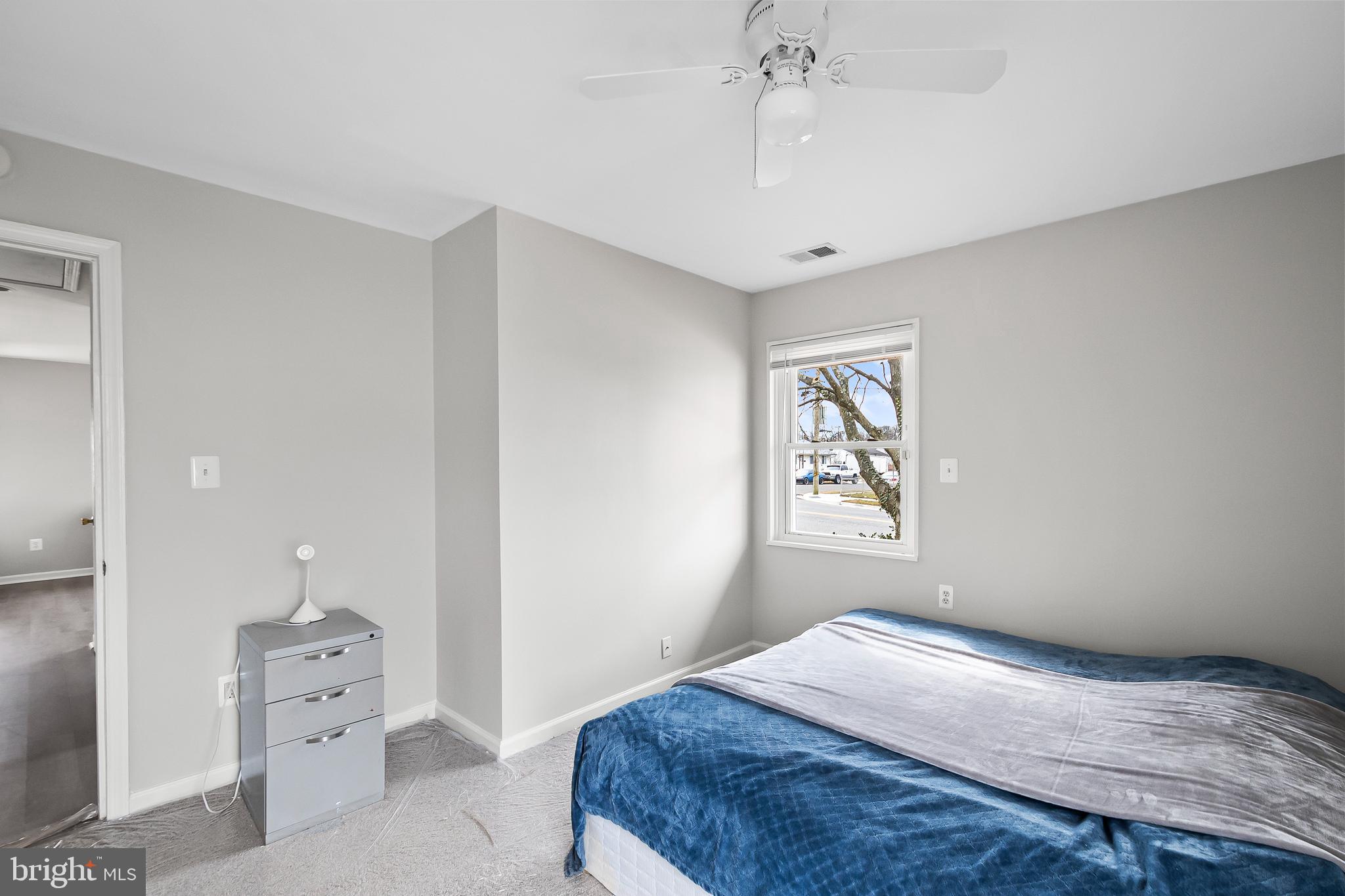 1204 Lindsay Road Oxon Hill, MD 20745 - Photo 17 of 28 a bedroom with a large bed and a window