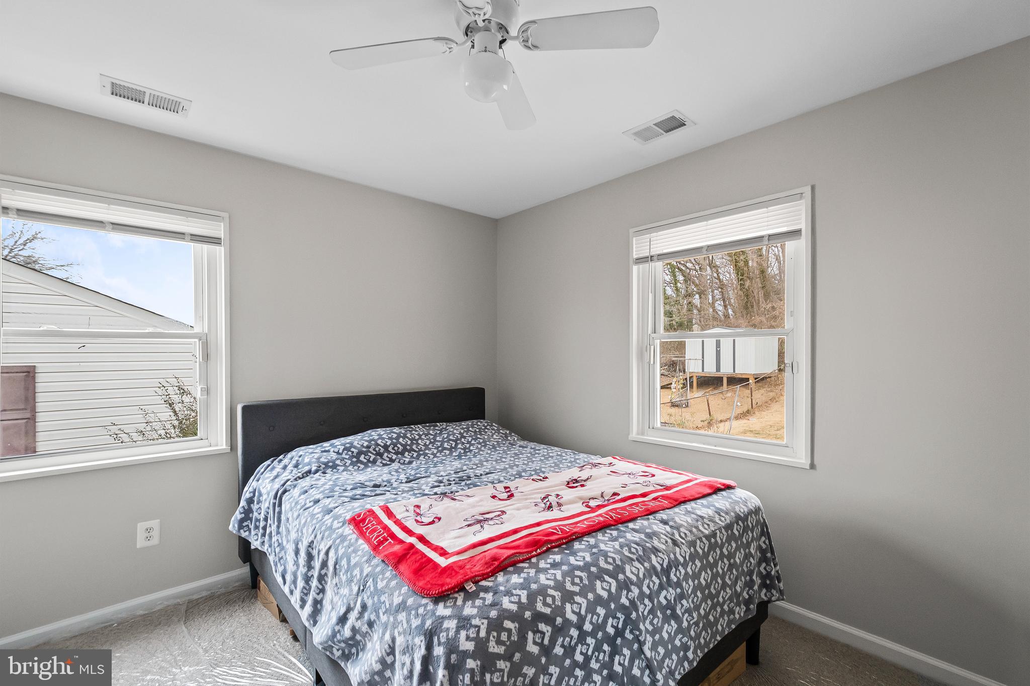 1204 Lindsay Road Oxon Hill, MD 20745 - Photo 19 of 28 a bedroom with a bed and a window