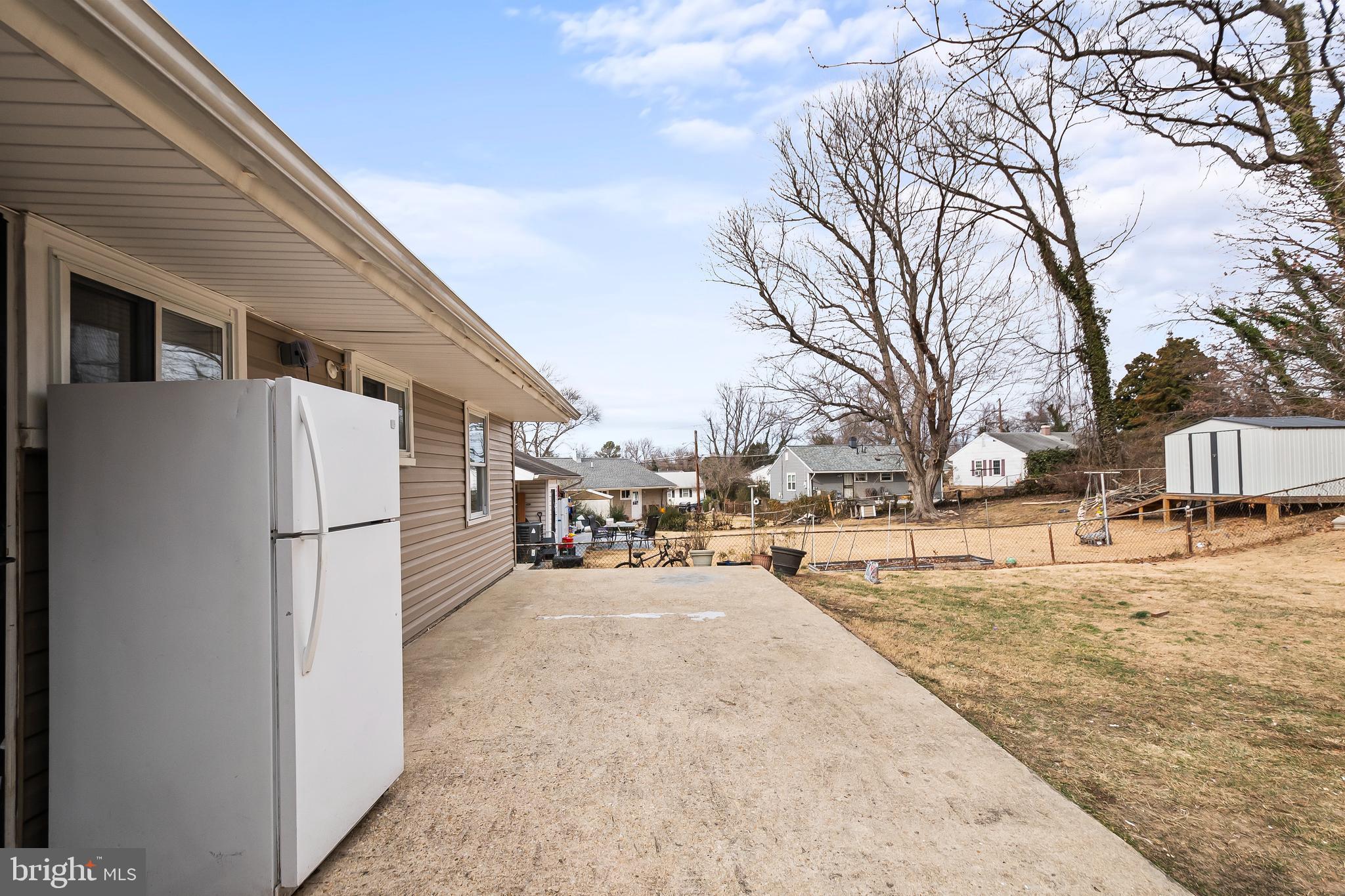 1204 Lindsay Road Oxon Hill, MD 20745 - Photo 24 of 28 a view of a white house covered in snow