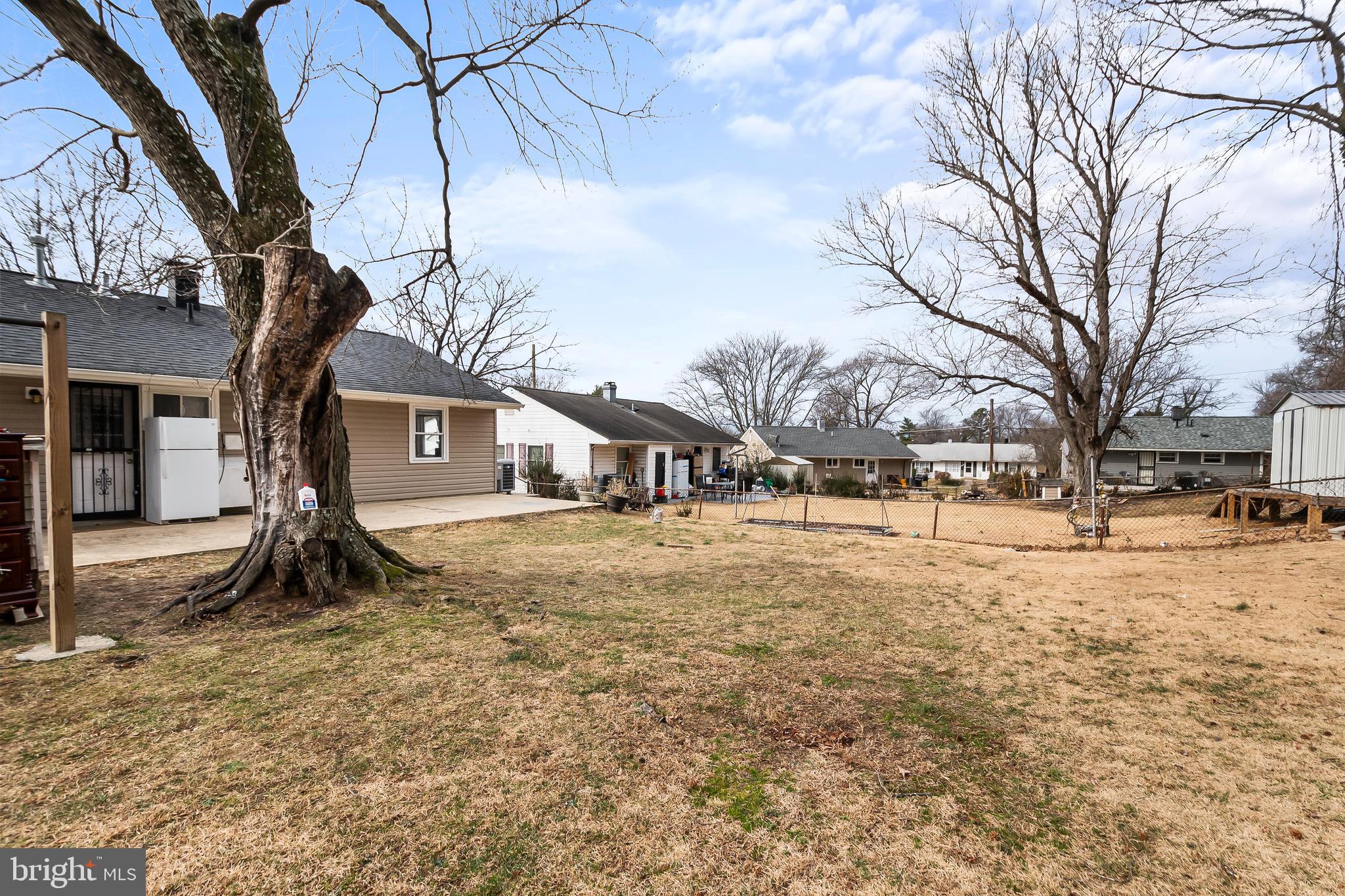 1204 Lindsay Road Oxon Hill, MD 20745 - Photo 27 of 28 a view of a yard with a large tree