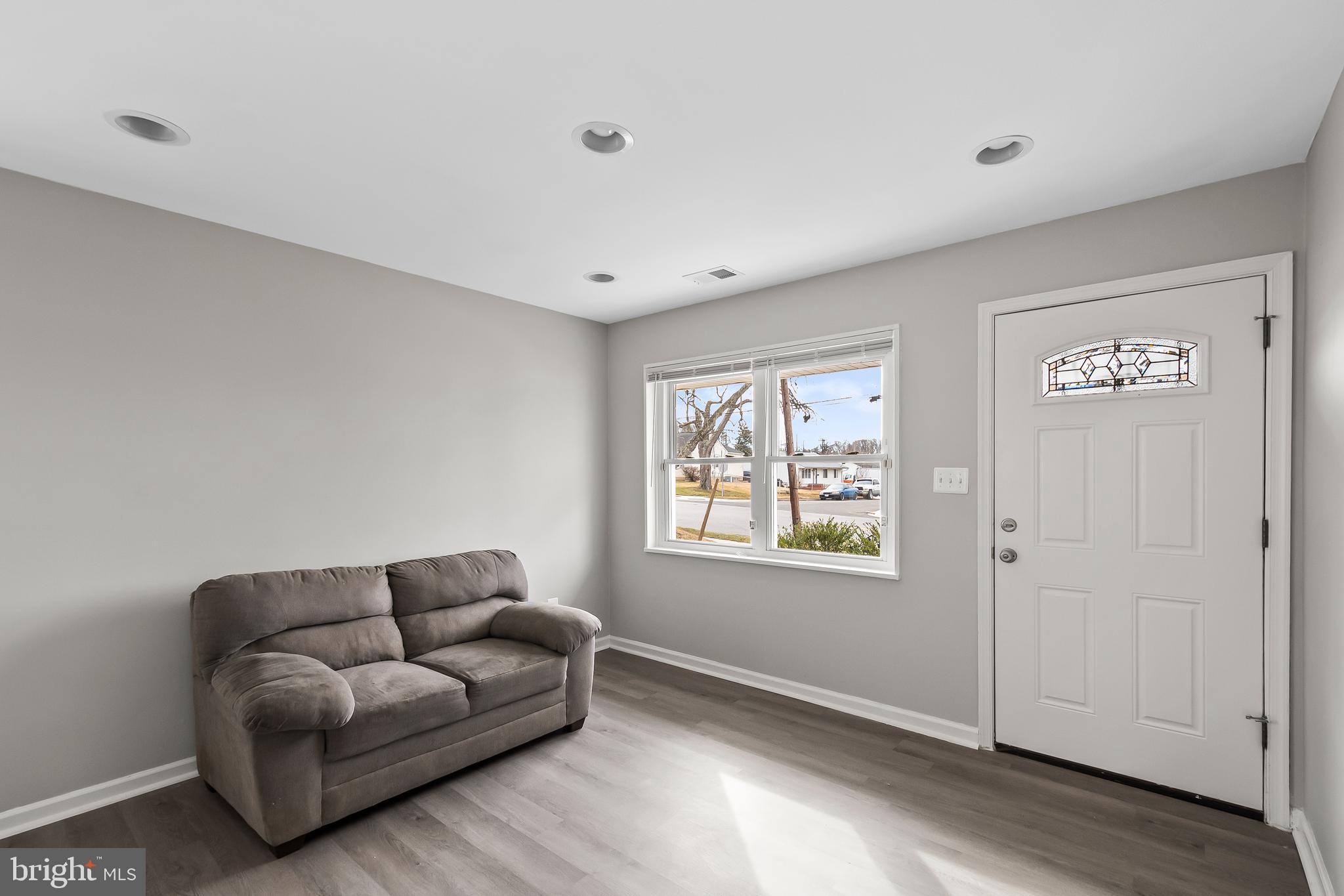 1204 Lindsay Road Oxon Hill, MD 20745 - Photo 5 of 28 a living room with furniture and a window