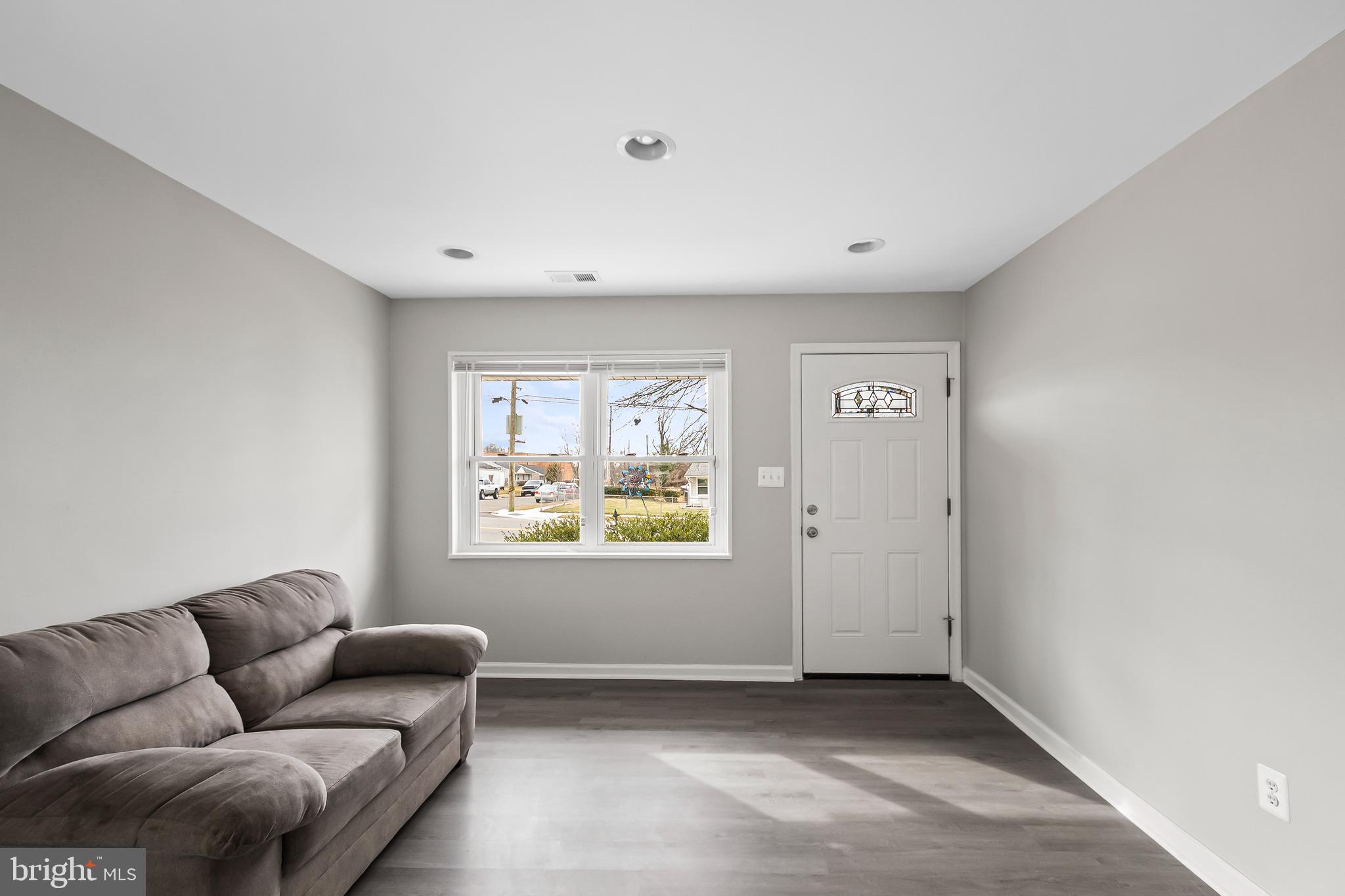 1204 Lindsay Road Oxon Hill, MD 20745 - Photo 6 of 28 a living room with furniture and window