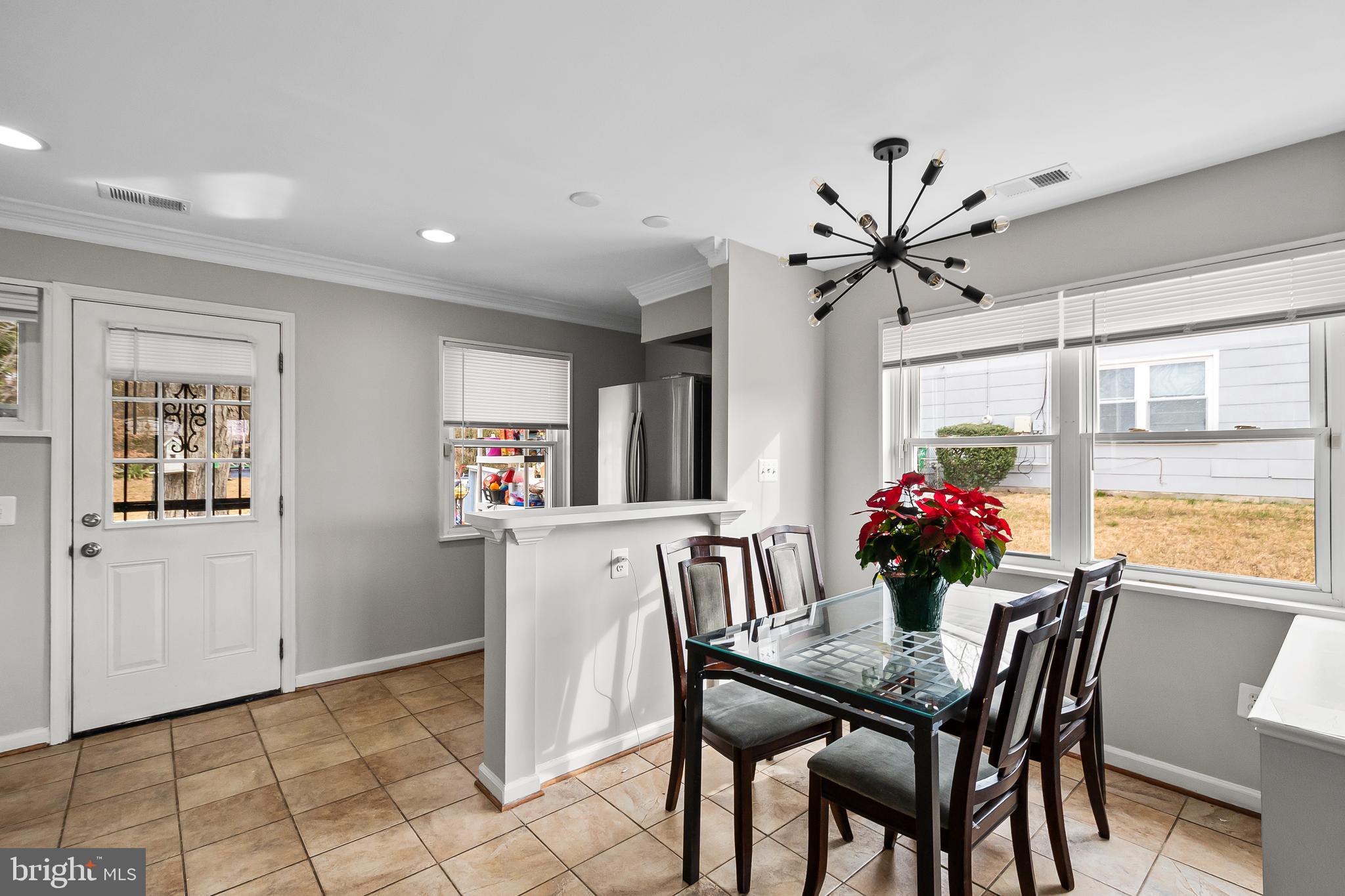 1204 Lindsay Road Oxon Hill, MD 20745 - Photo 8 of 28 a view of a dining room with furniture and window