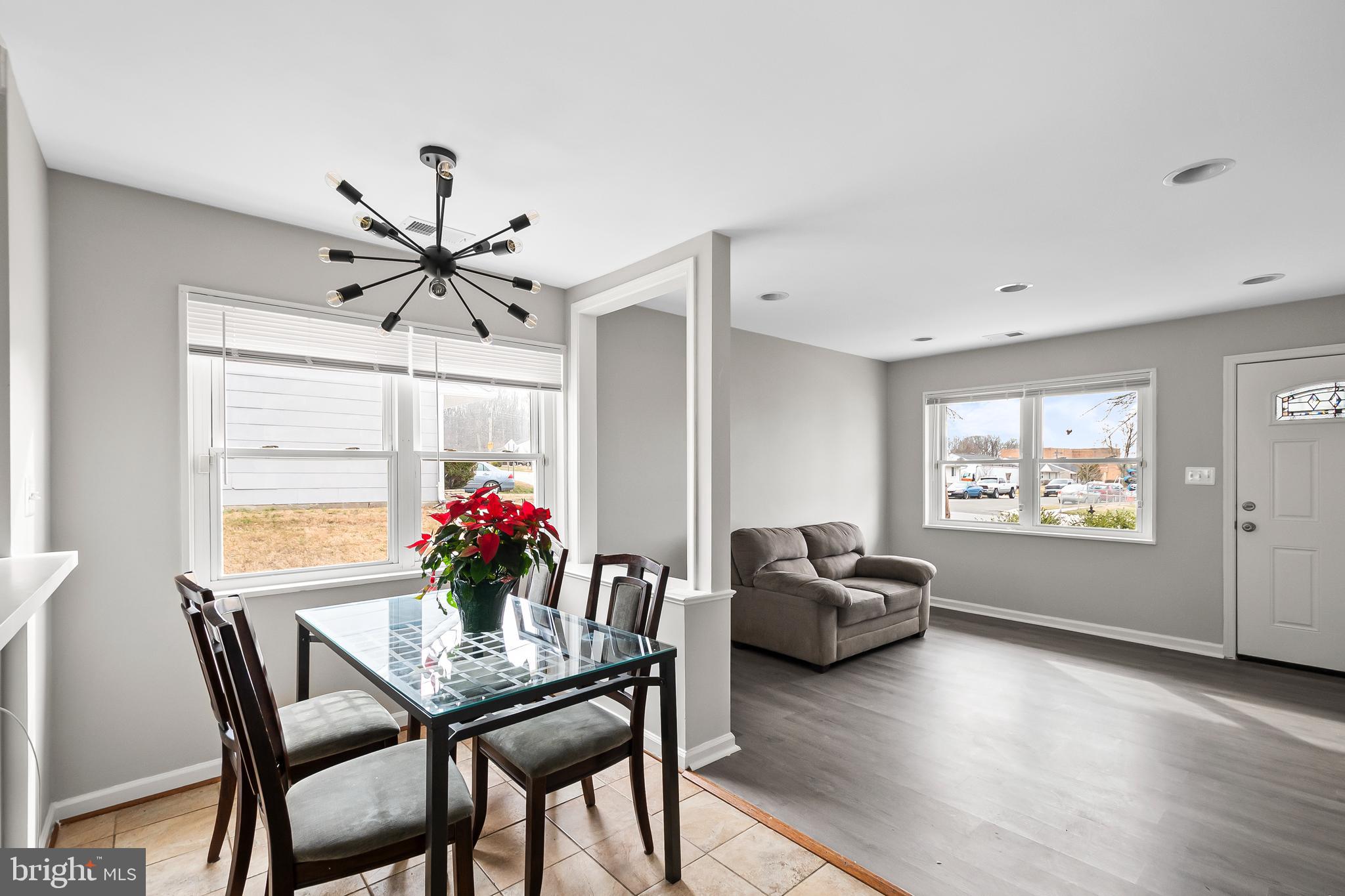 1204 Lindsay Road Oxon Hill, MD 20745 - Photo 9 of 28 a view of a dining room with furniture window and wooden floor