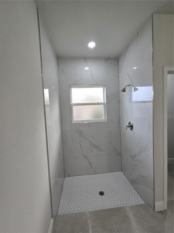 2717 Southwest 140th Loop Ocala, FL 34473 - Photo 23 of 40 a bathroom with a shower and toilet